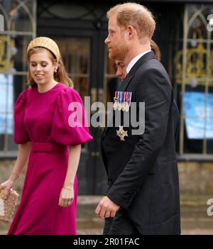 The Duke of Sussex and Princess Beatrice arriving at Westminster Abbey, central London, ahead of the coronation ceremony of King Charles III and Queen Camilla. Picture date: Saturday May 6, 2023. Stock Photo