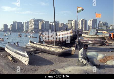 a fishing village with the Skyline at a Beach and Coast in Colaba in the city centre of Mumbai in India.  India, Mumbai, March, 1998 Stock Photo