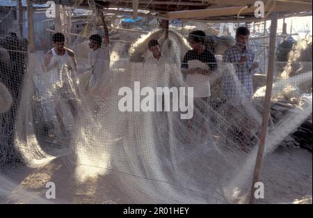 workers at the outdoor Laundry Dhobi Ghat at Mahalaxmi in the city centre of Mumbai in India.  India, Mumbai, March, 1998 Stock Photo