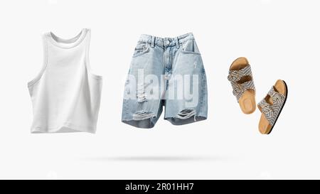 Trendy flying cotton tank top, blue jeans shorts, vegan cork sandals isolated on gray background. Clean white crop top. Branding clothes. Mock up for Stock Photo