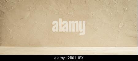Minimalist kitchen background in spring or summer warm sand tones. Light wood tabletop and stone wall Stock Photo