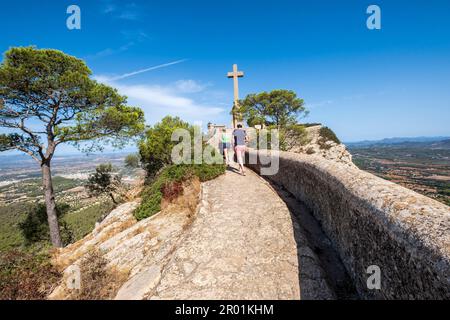 family ascending to picot cross, Sanctuary of the Mare de Déu de Sant Salvador, XIV century., Felanitx, Majorca, Balearic Islands, Spain. Stock Photo