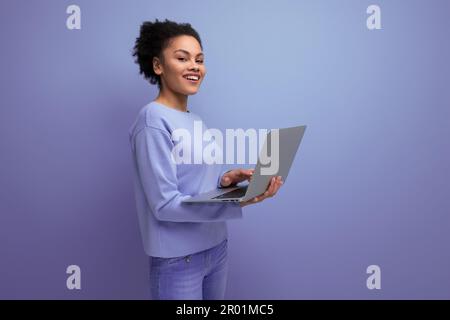 successful young afro hair brunette business woman working using laptop Stock Photo