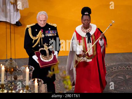 RETRANSMITTED CORRECTING CROWN The Orb, the Sceptre with Dove and St Edward's Crown are brought to the thrones before the coronation of King Charles III and Queen Camilla at Westminster Abbey, London. Picture date: Saturday May 6, 2023. Stock Photo