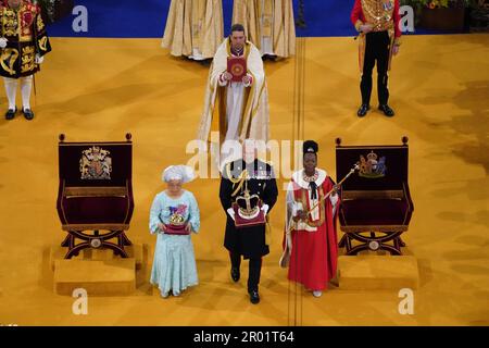 RETRANSMITTED CORRECTING CROWN The Orb, the Sceptre with Dove and St Edward's Crown are brought to the thrones before the coronation of King Charles III and Queen Camilla at Westminster Abbey, London. Picture date: Saturday May 6, 2023. Stock Photo