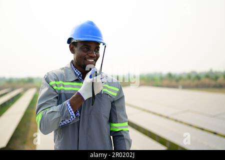 Maintenance technician working on ecological solar cell farm Stock Photo