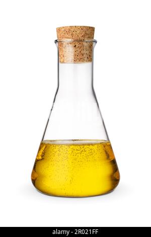 Unrefined sunflower oil in glass bottle or container with cork isolated on white background. Stock Photo