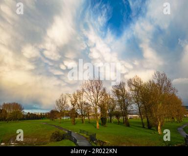 Evening mammatus clouds display in Tallaght after a day of April showers Stock Photo
