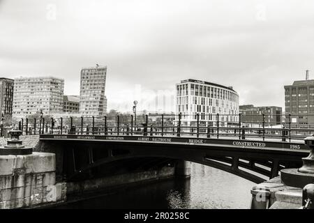 Floating Earth Artwork  and visitors at Liverpool's Albert Dock Stock Photo