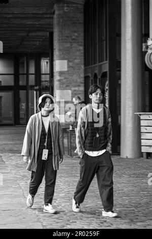 Floating Earth Artwork  and visitors at Liverpool's Albert Dock Stock Photo