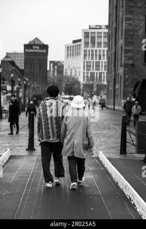 Floating Earth Artwork  and visitors at Liverpool's Albert Dock Stock Photo