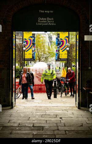 Floating Earth Artwork  and visitors at Liverpool's Albert Dock Stock Photo