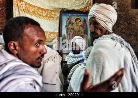 Lalibela, Ethiopia - January 6, 2018: Pilgrims inside the Biete Giyorgis (Church of Saint George) in Lalibela, Ethiopia. Stock Photo