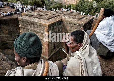 Lalibela, Ethiopia - January 6, 2018: Pilgrims around the Biete Giyorgis (Church of Saint George) in Lalibela, Ethiopia. Stock Photo