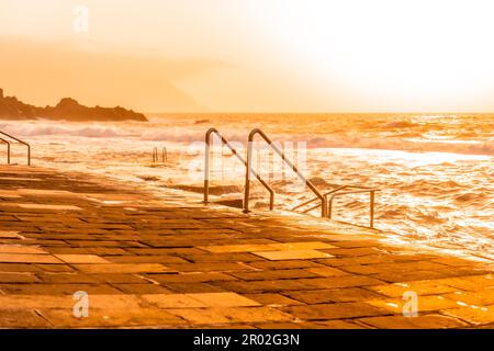 Stairs at sunset in the La Maceta rock pool on the island of El Hierro en la Frontera, Canary Islands Stock Photo