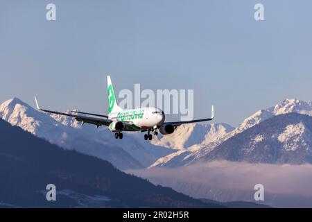 Aircraft on approach, airline Transavia Airlines, Boeing 737-700, snow lies on the mountains, Kranebitten Airport, Innsbruck, Tyrol, Austria Stock Photo