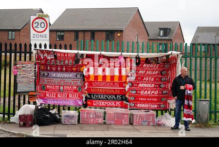 A street vendor sells merchandise ahead of the Premier League match at Anfield, Liverpool. Picture date: Saturday May 6, 2023. Stock Photo