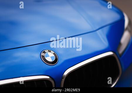 Izmir, Turkey - May 6, 2023: BMW Logo on a blue colored BMW brand car. Stock Photo