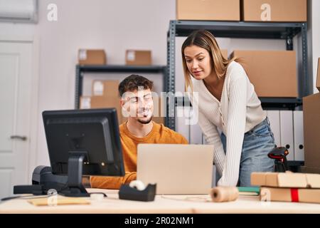 Young man and woman ecommerce business workers having video call at office Stock Photo