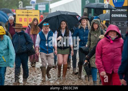 Bristol, UK. 06th May, 2023. 6th May 2023. Spectators wading through the mud on Day 2 of the 2023 Badminton Horse Trials presented by MARS at Badminton House near Bristol, Gloucestershire, England, United Kingdom. Credit: Jonathan Clarke/Alamy Live News Stock Photo