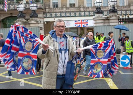 London, UK. 6 May, 2023. A man selling Union Jack flags before the Coronation of King Charles III. Credit: horst friedrichs/Alamy Live News Stock Photo