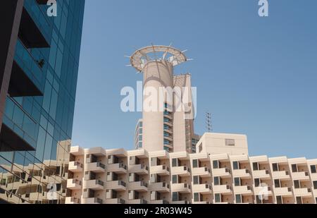 Abu Dhabi, UAE - March 19, 2023: Abu Dhabi Mall and Beach Rotana Hotel. View from the water, of the Beach Rotana Hotel and the Abu Dhabi Mall, with re Stock Photo