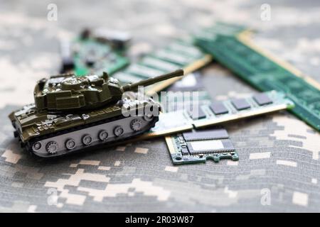 The toy tank is on the table. Children's toy military tank Stock Photo