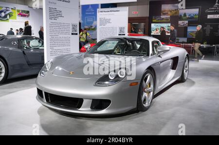 Toronto, Canada - 02 25 2023: GT Silver Porsche Carrera GT two-door mid-engine sports car displayed on 2023 Canadian International AutoShow. Project Stock Photo