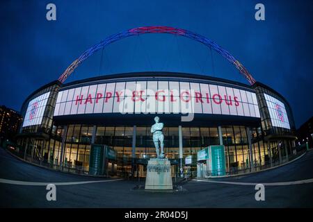 Wembley Stadium, London, UK. 6th May 2023. Wembley Stadium sends it's congratulations and best wishes to Their Majesties King Charles III and Queen Camilla on their Coronation. Following the coronation of King Charles III earlier today, the National Stadium lit the arch in Red, White and Blue and displayed a celebratory message 'Happy & Glorious' this evening to mark the occasion. Photo by Amanda Rose/Alamy Live News Stock Photo