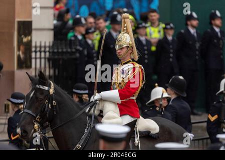 Life Guards of Household Cavalry Mounted Regiment in Whitehall in the Royal Procession heading to Westminster Abbey for Coronation of King Charles III Stock Photo