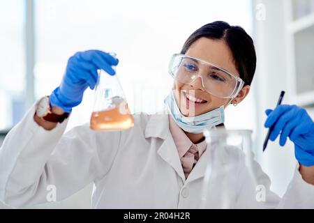 Lets test this. a young scientist doing an experiment in a lab. Stock Photo