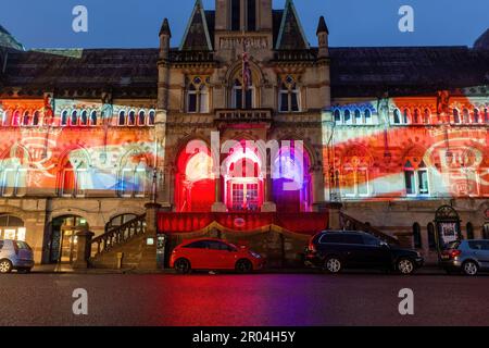 May 6th 2023. Winchester, Hampshire, England, UK. On the evening of the Coronation of King Charles III and Queen Camilla, the Guildhall in Winchester city centre was illuminated with projections of the King's life and coronation symbols to celebrate the occasion. Stock Photo