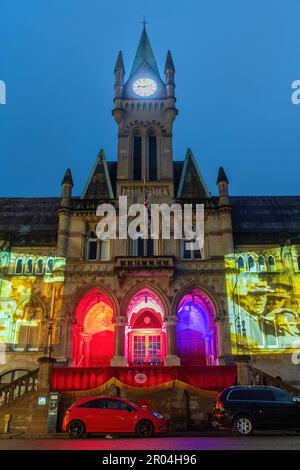 May 6th 2023. Winchester, Hampshire, England, UK. On the evening of the Coronation of King Charles III and Queen Camilla, the Guildhall in Winchester city centre was illuminated with projections of the King's life and coronation symbols to celebrate the occasion. Stock Photo