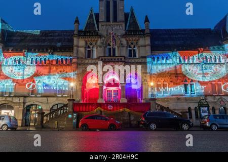 May 6th 2023. Winchester, Hampshire, England, UK. On the evening of the Coronation of King Charles III and Queen Camilla, the Guildhall in Winchester city centre was illuminated with projections of the King's life and coronation symbols to celebrate the occasion. Stock Photo