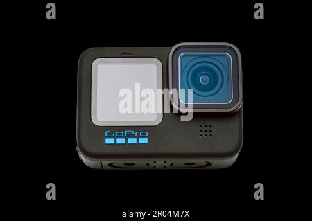 GoPro Hero 11 Black Camera on a black background.  It has a clipping path for putting camera on other backgrounds. Stock Photo