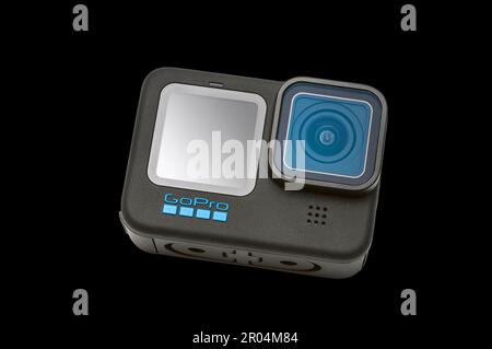 GoPro Hero 11 Black Camera on a black background.  It has a clipping path for putting camera on other backgrounds. Stock Photo