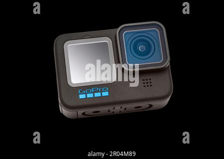 GoPro Hero 11 Black Camera on a black background.  It has a clipping path for putting camera on other backgrounds. Stock Photo