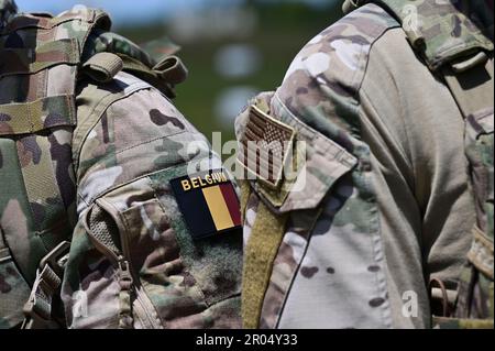 A member of the Belgian Army Special Operations Regiment and a U.S. Air Force tactical air control party specialist assigned to 165th Air Support Operations Squadron, Georgia Air National Guard, stand side-by-side after close air support training at Camp Shelby Joint Forces Training Center, Mississippi, April 24, 2023. Exercise Southern Strike is a total-force, multi-national training event hosted annually by the Mississippi National Guard in Gulfport with distributed basing sites and complex scenarios designed to test and validate the shared agile combat employment (ACE) concept. (U.S. Air Fo Stock Photo