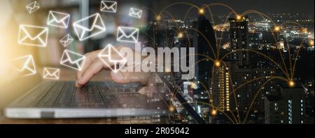 Man's Hand Using Computer Notebook to Manage Emails with Internet Network Connecting Locations Stock Photo
