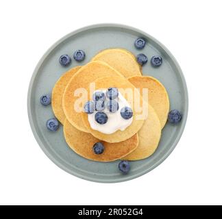 Tasty pancakes with natural yogurt and blueberries on white background Stock Photo