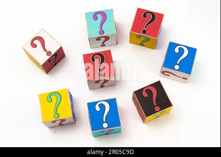Question mark written on wooden blocks isolated on white background in top view. Stock Photo