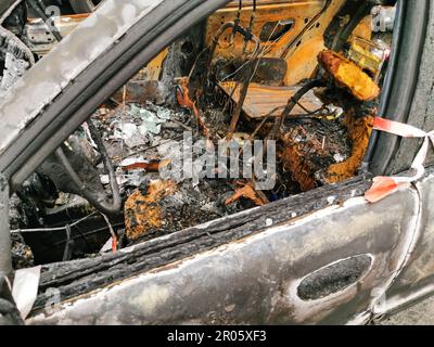 Burnt new car. burnt metal texture, metallic background. Stock Photo