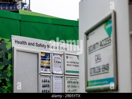 London. UK- 05.04.2023. A health and safety notice board by the entrance to a construction site. Stock Photo