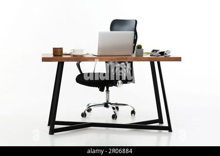 Comfortable office chair near table with modern computer Stock Photo