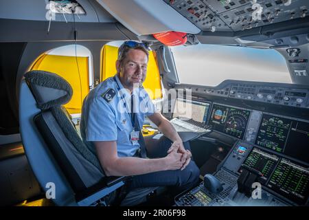 04 May 2023, Brandenburg, Schönefeld: Flight captain Lieutenant Colonel Michael Weyerer, photographed on board the Airbus A350-900 'Konrad-Adenauer' of the BMVg's Special Air Mission Wing on Chancellor Scholz's flight from Berlin to Addis Ababa. The Bundeswehr Air Force's flight readiness unit handles the German government's flights at home and abroad. Photo: Michael Kappeler/dpa Stock Photo
