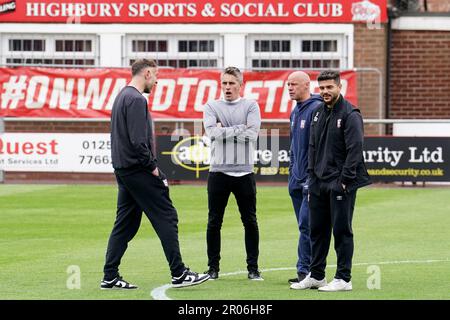 (From left to right) Ipswich Town’s Richard Keogh, Ipswich Town Manager, Richard McKenna, Ipswich Town Assistant Manager, Martyn Pert, and Ipswich Town’s Sam Morsy interact with each other ahead of the Sky Bet League One match at Highbury Stadium, Fleetwood. Picture date: Sunday May 7, 2023. Stock Photo