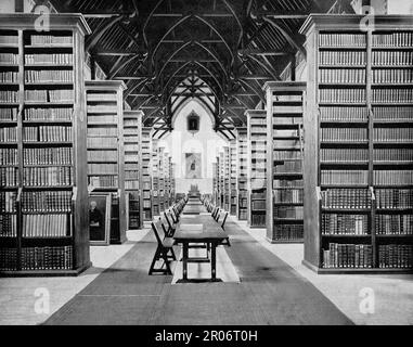 A late 19th century view of the Russell Library holding the historical collections of St Patrick’s College, Maynooth which was founded in 1795 as a seminary for the education of Irish priests. The reading room was designed by renowned British architect and designer Augustus Welby Northmore Pugin (1812-1852) and completed in the year 1861. The Library contains approximately 34,000 printed works with imprints from the 15th to the mid-19th century. The collection includes approximately 7,000 ESTC items, 59 incunabula, over 12,000 pamphlets in bound volumes, and 2,500 Bibles. Stock Photo