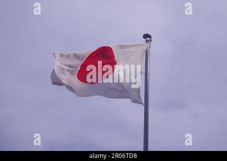 Flag of Japan blowing in the Wind Stock Photo