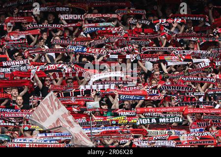 Nuremberg, Germany. 07th May, 2023. Soccer: 2nd Bundesliga, 1. FC Nürnberg - 1. FC Kaiserslautern, Matchday 31 at Max Morlock Stadium. Nuremberg fans sing the club anthem before the start of the game. Credit: Daniel Karmann/dpa - IMPORTANT NOTE: In accordance with the requirements of the DFL Deutsche Fußball Liga and the DFB Deutscher Fußball-Bund, it is prohibited to use or have used photographs taken in the stadium and/or of the match in the form of sequence pictures and/or video-like photo series./dpa/Alamy Live News Stock Photo