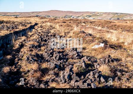 Peat Turf cutting in County Donegal - Ireland. Stock Photo